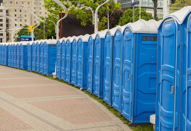 a row of portable restrooms set up for a large athletic event, allowing participants and spectators to easily take care of their needs in Burlington KY